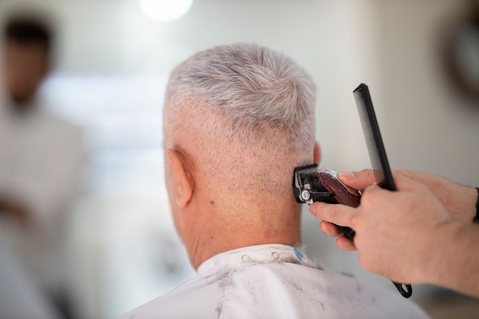 Barber giving a men's haircut